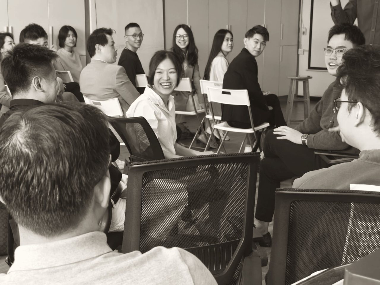A room of leaders in a live Business Enneagram community session — real dialogue, real faces